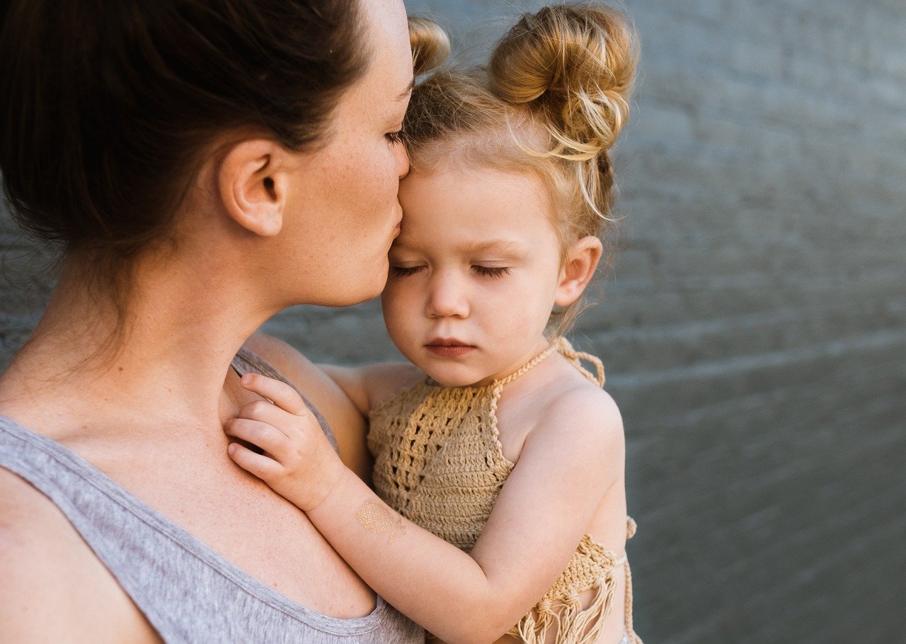 Woman holding her child